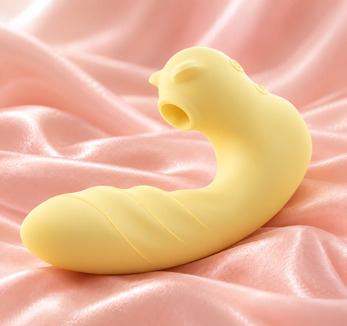 The Triple Treat yellow suction vibrator on pink satin
